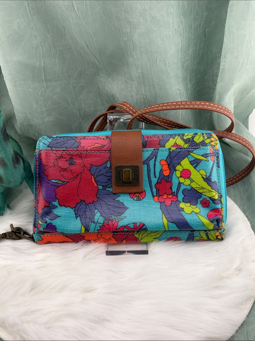 Sakroots Artist Circle smartphone crossbody wallet in a vibrant floral print